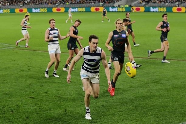 Jeremy Cameron of the Cats chases the ball to the boundary during the 2021 AFL Second Semi Final match between the Geelong Cats and the GWS Giants at...