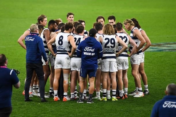 The Cats huddle at the end of the match during the 2021 AFL Second Semi Final match between the Geelong Cats and the GWS Giants at Optus Stadium on...