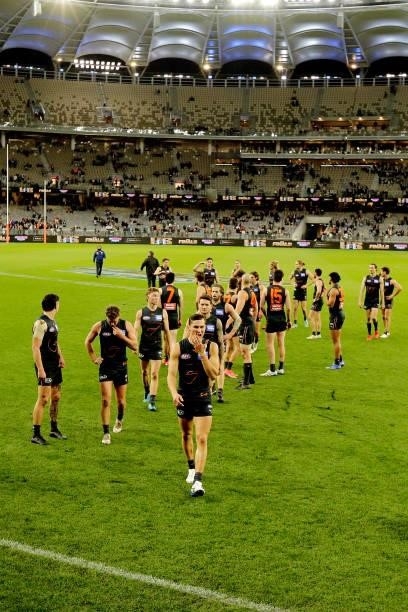 The Giants leave the field after the teams defeat during the 2021 AFL Second Semi Final match between the Geelong Cats and the GWS Giants at Optus...