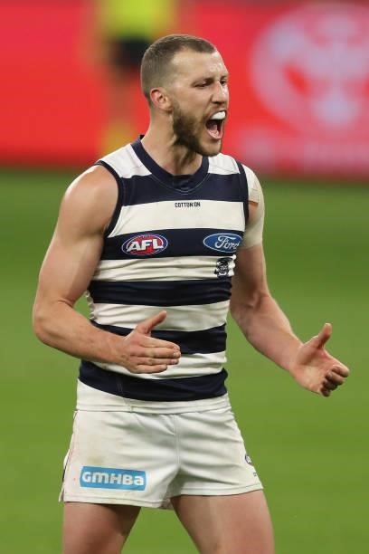 Sam Menegola of the Cats celebrates after scoring a goal during the 2021 AFL Second Semi Final match between the Geelong Cats and the GWS Giants at...