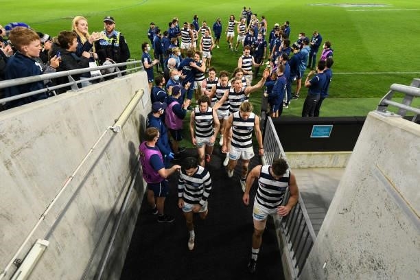 The Cats head to the rooms after the win during the 2021 AFL Second Semi Final match between the Geelong Cats and the GWS Giants at Optus Stadium on...