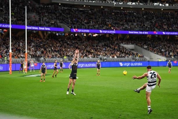 Tom Hawkins of the Cats kicks on goal during the 2021 AFL Second Semi Final match between the Geelong Cats and the GWS Giants at Optus Stadium on...