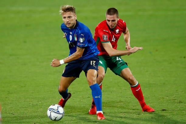 Ciro Immobile of Italy and Valentin Antov of Bulgaria battle for the ball during the 2022 FIFA World Cup Qualifier Group C match between Italy and...