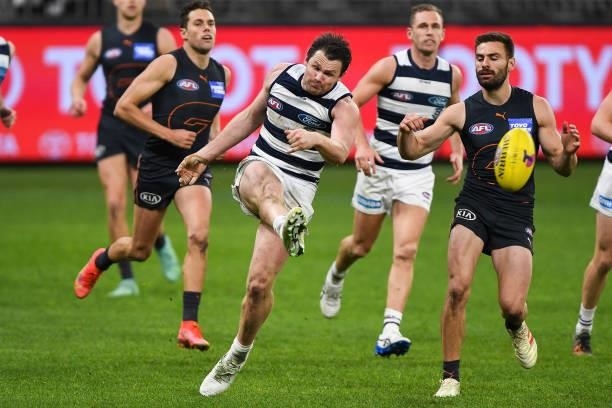 Patrick Dangerfield of the Cats kicks the ball during the 2021 AFL Second Semi Final match between the Geelong Cats and the GWS Giants at Optus...