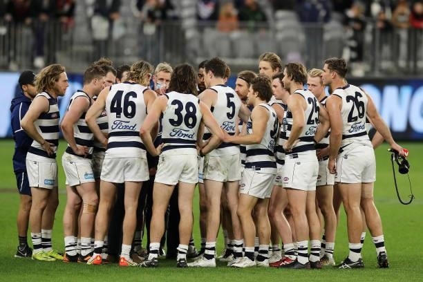 The Cats form a huddle after their win during the 2021 AFL Second Semi Final match between the Geelong Cats and the GWS Giants at Optus Stadium on...