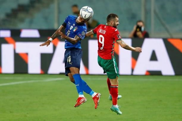 Emerson Palmieri of Italy and Spas Delev of Bulgaria battle for the ball during the 2022 FIFA World Cup Qualifier Group C match between Italy and...