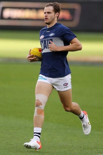 Jake Kolodjashnij of the Cats warms up before the 2021 AFL Second Semi Final match between the Geelong Cats and the GWS Giants at Optus Stadium on...