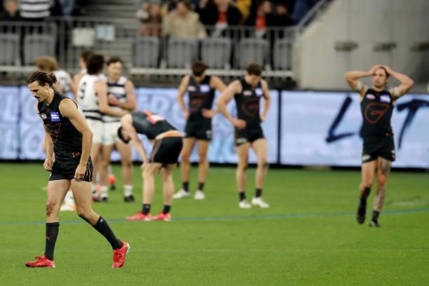 The players react after the final siren during the 2021 AFL Second Semi Final match between the Geelong Cats and the GWS Giants at Optus Stadium on...