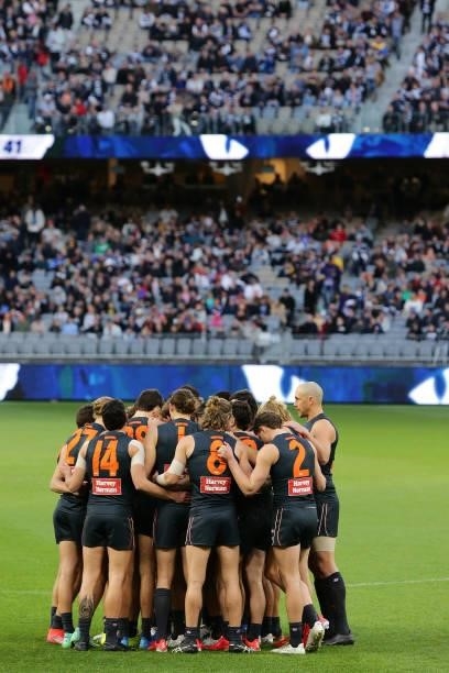 The Giants form a huddle during the 2021 AFL Second Semi Final match between the Geelong Cats and the GWS Giants at Optus Stadium on September 3,...