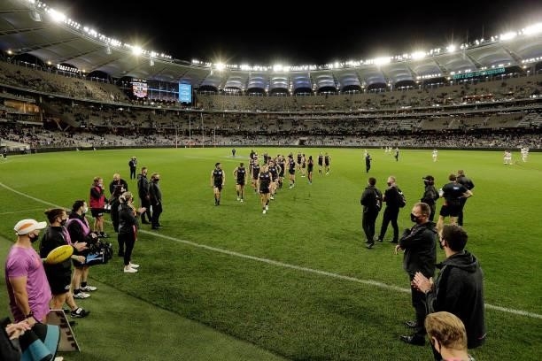 The Giants leave the field after the teams defeat during the 2021 AFL Second Semi Final match between the Geelong Cats and the GWS Giants at Optus...
