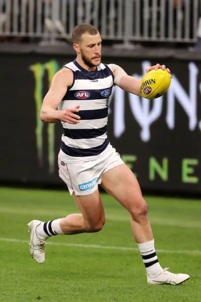 Sam Menegola of the Cats looks to pass the ball during the 2021 AFL Second Semi Final match between the Geelong Cats and the GWS Giants at Optus...