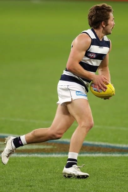 Tom Atkins of the Cats looks to pass the ball during the 2021 AFL Second Semi Final match between the Geelong Cats and the GWS Giants at Optus...