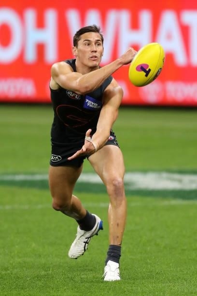Isaac Cumming of the Giants handpasses the ball during the 2021 AFL Second Semi Final match between the Geelong Cats and the GWS Giants at Optus...