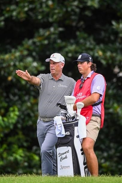Stewart Cink talks with his caddie and son Reagan on the second hole during the first round of the TOUR Championship, the final event of the FedExCup...