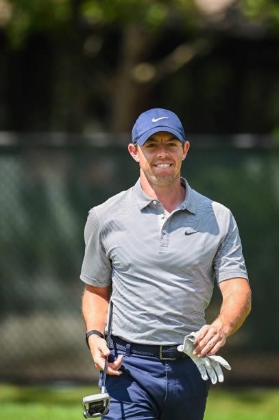 Rory McIlroy of Northern Ireland smiles after nearly holing out on the 11th hole during the first round of the TOUR Championship, the final event of...