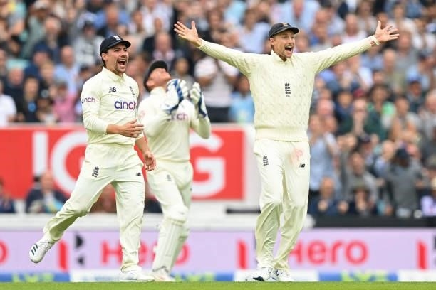 England's captain Joe Root celebrates as England's James Anderson takes the wicket of India's KL Rahul during play on the third day of the fourth...