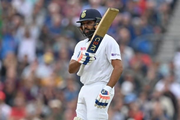India's Rohit Sharma celebrates reaching his half century during play on the third day of the fourth cricket Test match between England and India at...