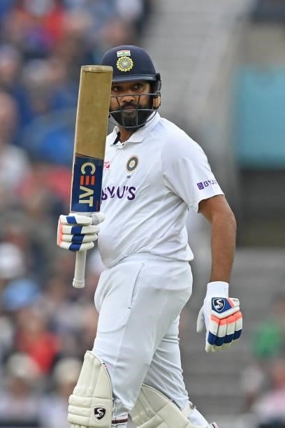 India's Rohit Sharma celebrates reaching his half century during play on the third day of the fourth cricket Test match between England and India at...