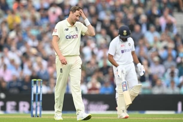England's Ollie Robinson reacts while bowling during play on the third day of the fourth cricket Test match between England and India at the Oval...