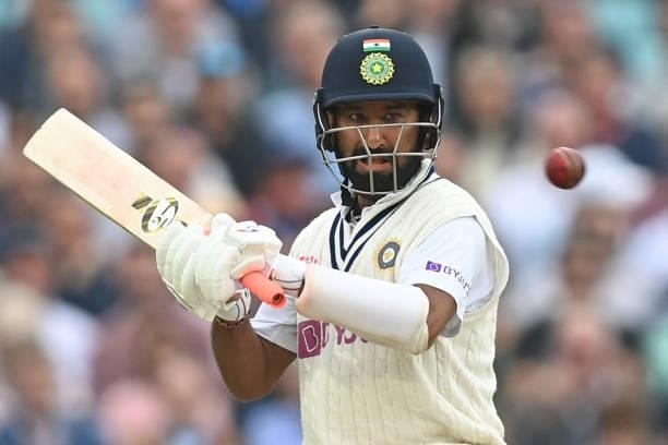 India's Cheteshwar Pujara watches the ball during play on the third day of the fourth cricket Test match between England and India at the Oval...