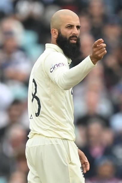 England's Moeen Ali gestures during play on the third day of the fourth cricket Test match between England and India at the Oval cricket ground in...