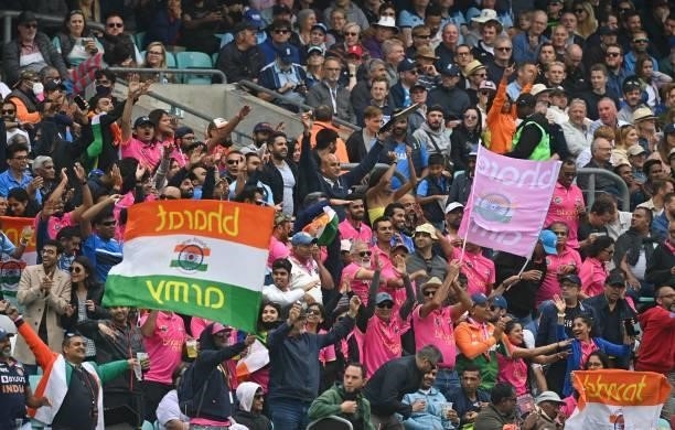 Indian fans cheers on their team during play on the third day of the fourth cricket Test match between England and India at the Oval cricket ground...
