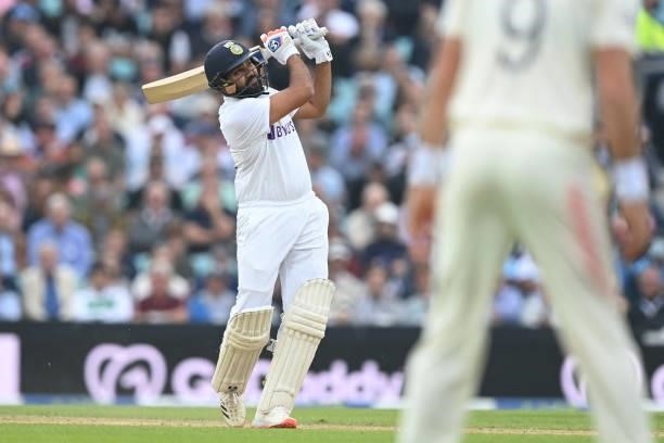 India's Rohit Sharma watches his six hit to bring up his century during play on the third day of the fourth cricket Test match between England and...