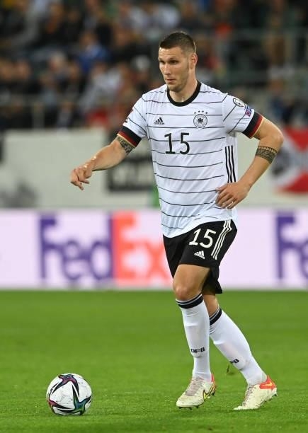 Germany's defender Niklas Suele plays the ball during the FIFA World Cup Qatar 2022 qualification Group J football match between Liechtenstein and...