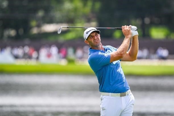 Dustin Johnson reacts to his shot on the eighth hole during the second round of the TOUR Championship, the final event of the FedExCup Playoffs, at...