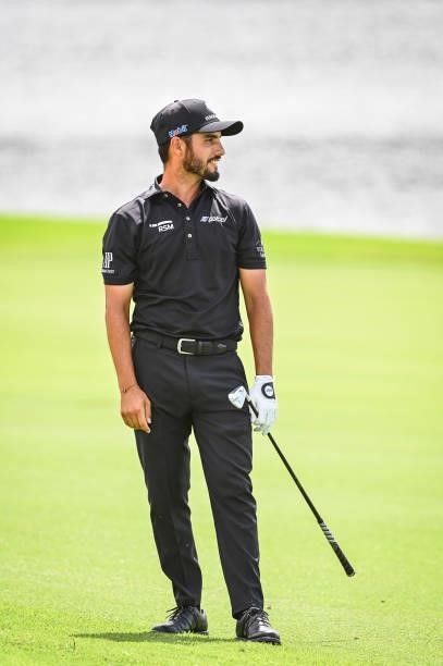 Abraham Ancer of Mexico smiles as he reacts to his shot from the eighth hole fairway during the second round of the TOUR Championship, the final...