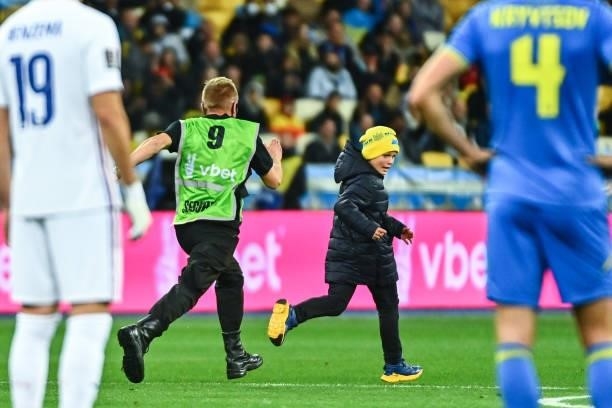 Young pitch invader during the FIFA World Cup 2022 Qatar qualifying match between Ukraine and France at Olympic Stadium on September 4, 2021 in Kyiv,...