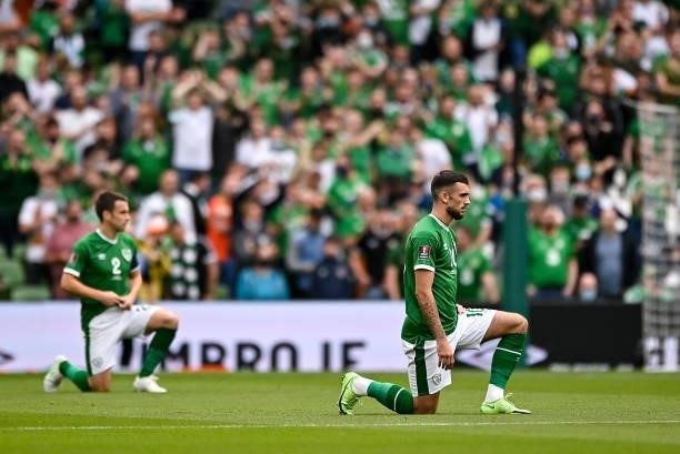 Dublin , Ireland - 4 September 2021; Republic of Ireland players Troy Parrott, right, and Seamus Coleman take a knee before the FIFA World Cup 2022...