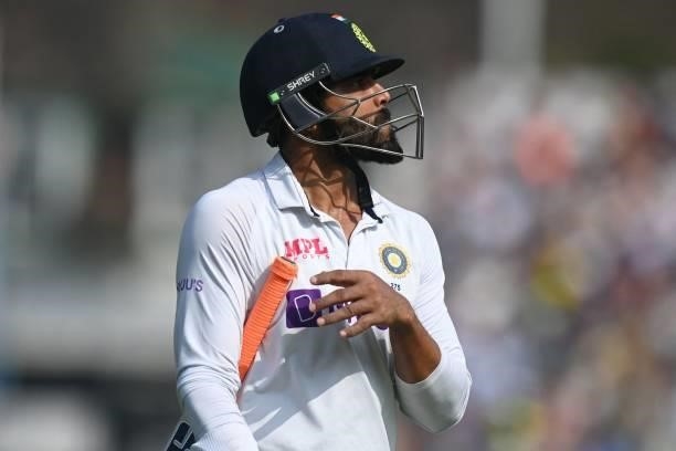 India's Ravindra Jadeja walks back to the pavilion after losing his wicket for 17 runs during play on the fourth day of the fourth cricket Test match...