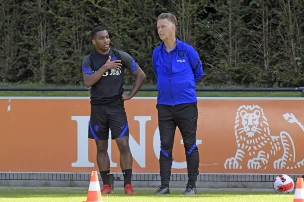 Dutch national football team's coach Louis van Gaal talks to his player Quinten Timber during a training session ahead of the team's FIFA World Cup...