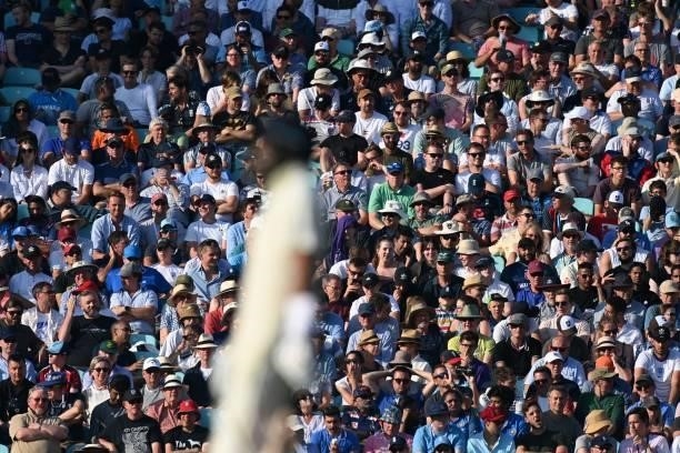 The crowd look on in the sunshine as England begin their second Innings during play on the fourth day of the fourth cricket Test match between...