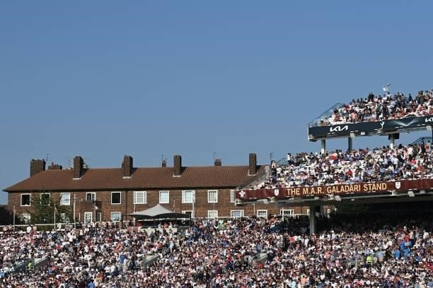 Fans in the packed grandstands watch in the sunshine on the fourth day of the fourth cricket Test match between England and India at the Oval cricket...