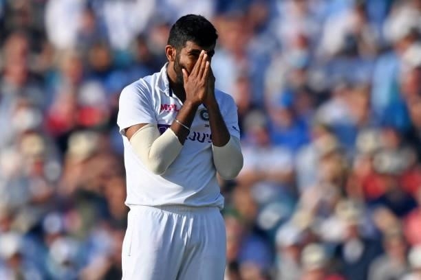 India's Jasprit Bumrah reacts as the ball narrowly misses the stumps during play on the fourth day of the fourth cricket Test match between England...