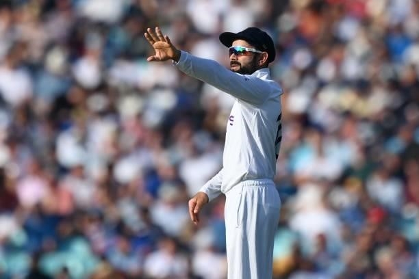 India's captain Virat Kohli alters his field during play on the fourth day of the fourth cricket Test match between England and India at the Oval...