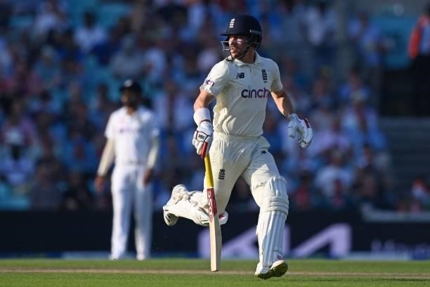 England's Rory Burns takes a run during play on the fourth day of the fourth cricket Test match between England and India at the Oval cricket ground...