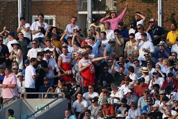 The crowd look on in the sunshine as England begin their second Innings during play on the fourth day of the fourth cricket Test match between...