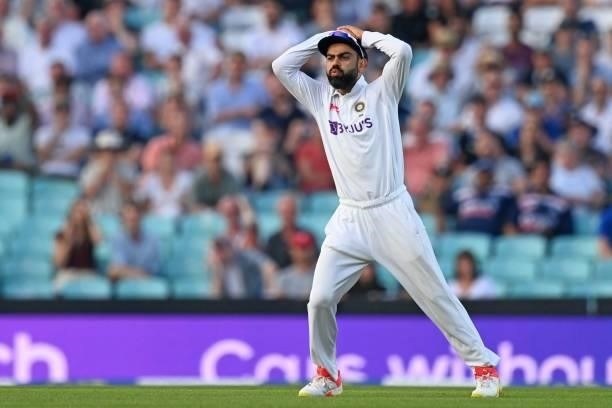 India's captain Virat Kohli reacts in the field during play on the fourth day of the fourth cricket Test match between England and India at the Oval...