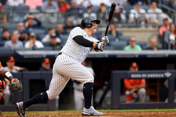Anthony Rizzo of the New York Yankees hits an RBI single against the Baltimore Orioles during the fifth inning of a game at Yankee Stadium on...