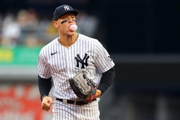 Aaron Judge of the New York Yankees blows a bubble as he runs in from center field against the Baltimore Orioles during the fifth inning of a game at...