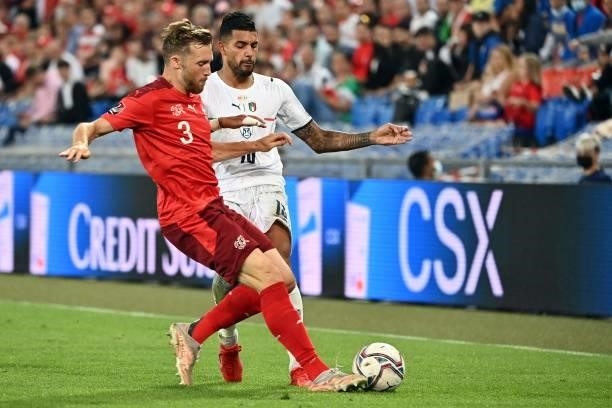 Switzerland's defender Silvan Widmer vies with Italy's forward Emerson during the World Cup 2022 qualifier football match between Switzerland and...