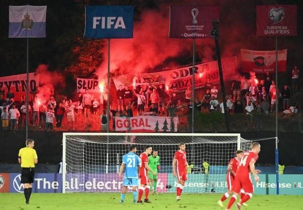 Poland supporters cheer and light flares during the FIFA World Cup Qatar 2022 qualifying Group I football match between San Marino and Poland at the...