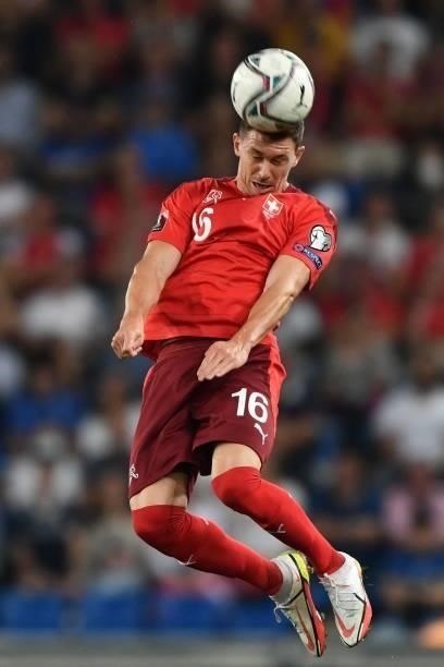 Switzerland's midfielder Christian Fassnacht heads the ball during the World Cup 2022 qualifier football match between Switzerland and Italy, on...