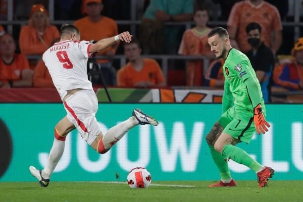 Justin Bijlow of Holland, Stefan Mugosa of Montenegro during the World Cup Qualifier match between Holland v Montenegro at the Philips Stadium on...