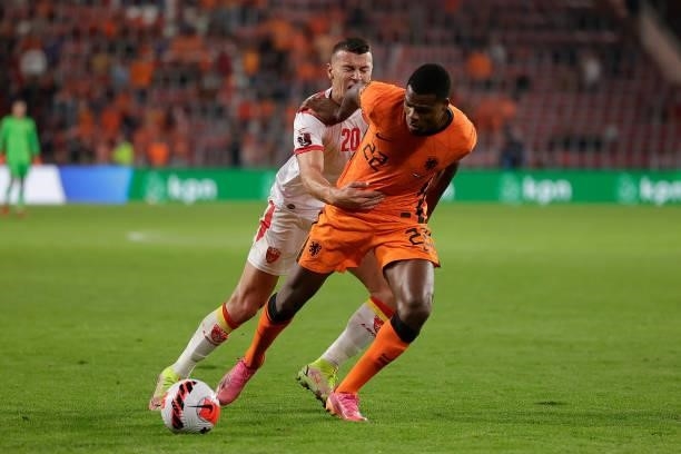 Milutin Osmajic of Montenegro. Denzel Dumfries of Holland during the World Cup Qualifier match between Holland v Montenegro at the Philips Stadium on...