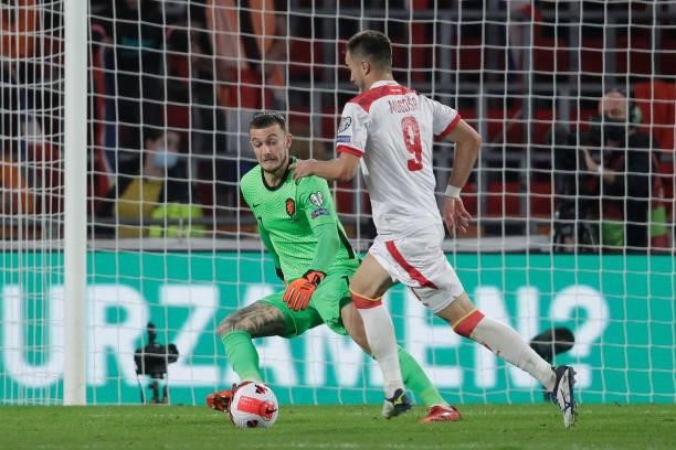 Justin Bijlow of Holland, Stefan Mugosa of Montenegro during the World Cup Qualifier match between Holland v Montenegro at the Philips Stadium on...