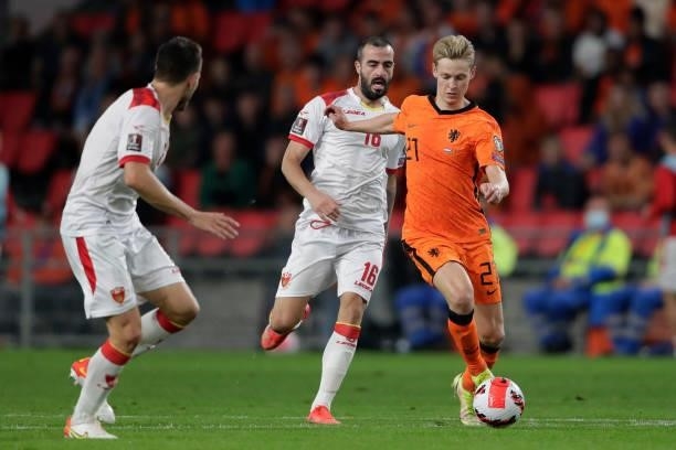 Frenkie de Jong of Holland, Milos Raickovic of Montenegro during the World Cup Qualifier match between Holland v Montenegro at the Philips Stadium on...
